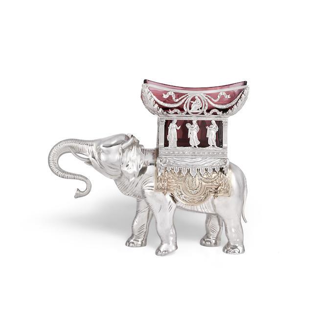 A German silver and silver-gilt Elephant centrepiece / bowl with crown and crescent mark, stamped 800, also with incuse stamped flower mark, stamped DEPOSE