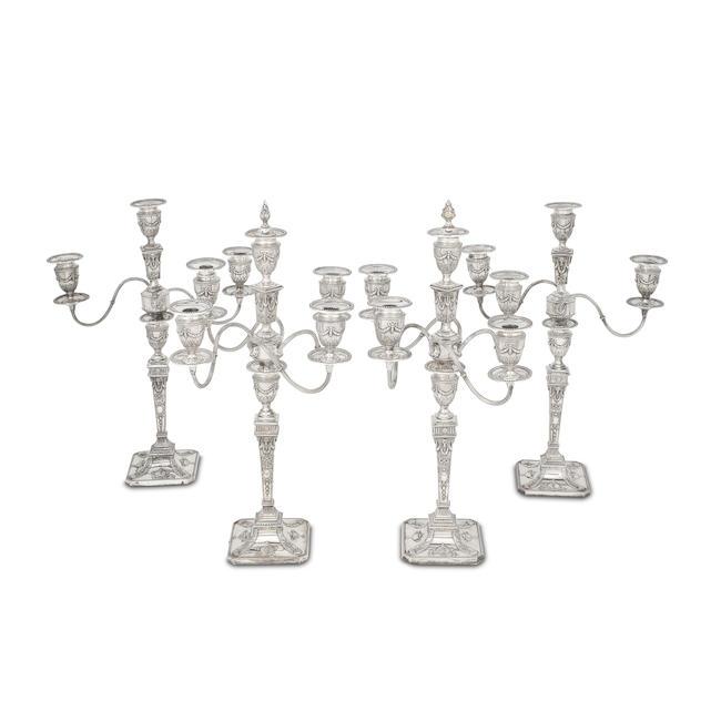 A suite of electroplated candelabra unmarked, late 19th / early 20th century (4)