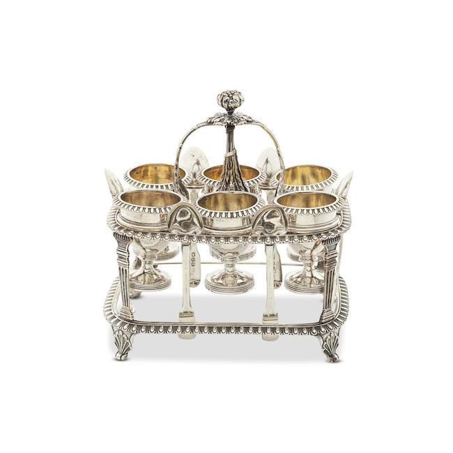 A George III silver egg cruet stand John Emes, London 1807, the egg cups Rebecca Emes & Edward Barnard, London 1811 (2)