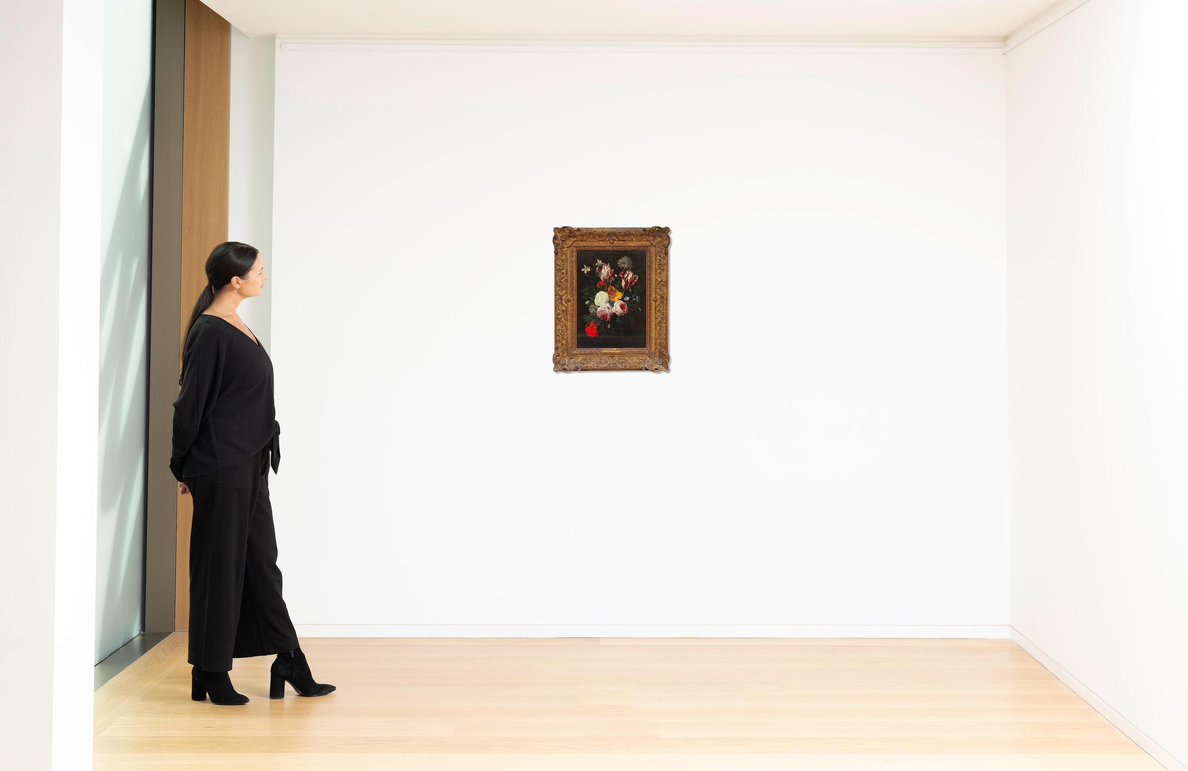 Follower of Daniel Seghers (Antwerp 1590-1661) A still life of tulips, roses, poppies and other flowers in a glass vase, on a stone ledge framed 64.3 x 51.2cm image 2
