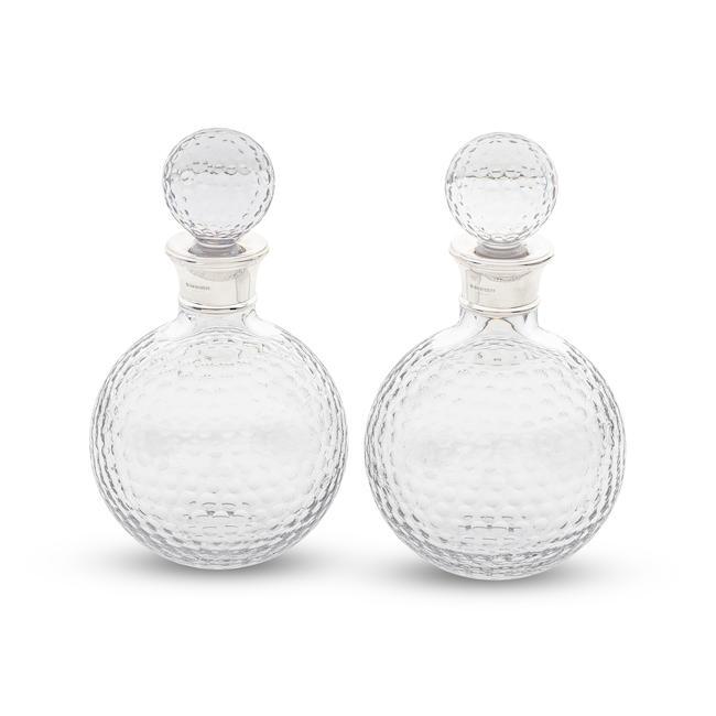 A pair of silver-mounted glass 'Golf Ball' decanters L J Millington, Birmingham 2019