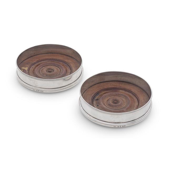 A pair of George III silver wine coasters Michael Plummer, London 1796 (2)